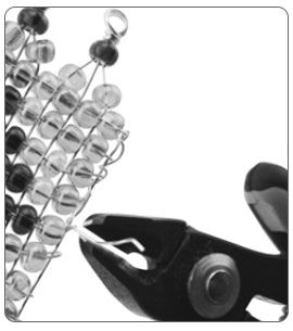 Wire cutters trimming excess wire